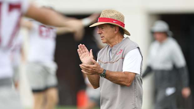 Nick Saban claps at practice
